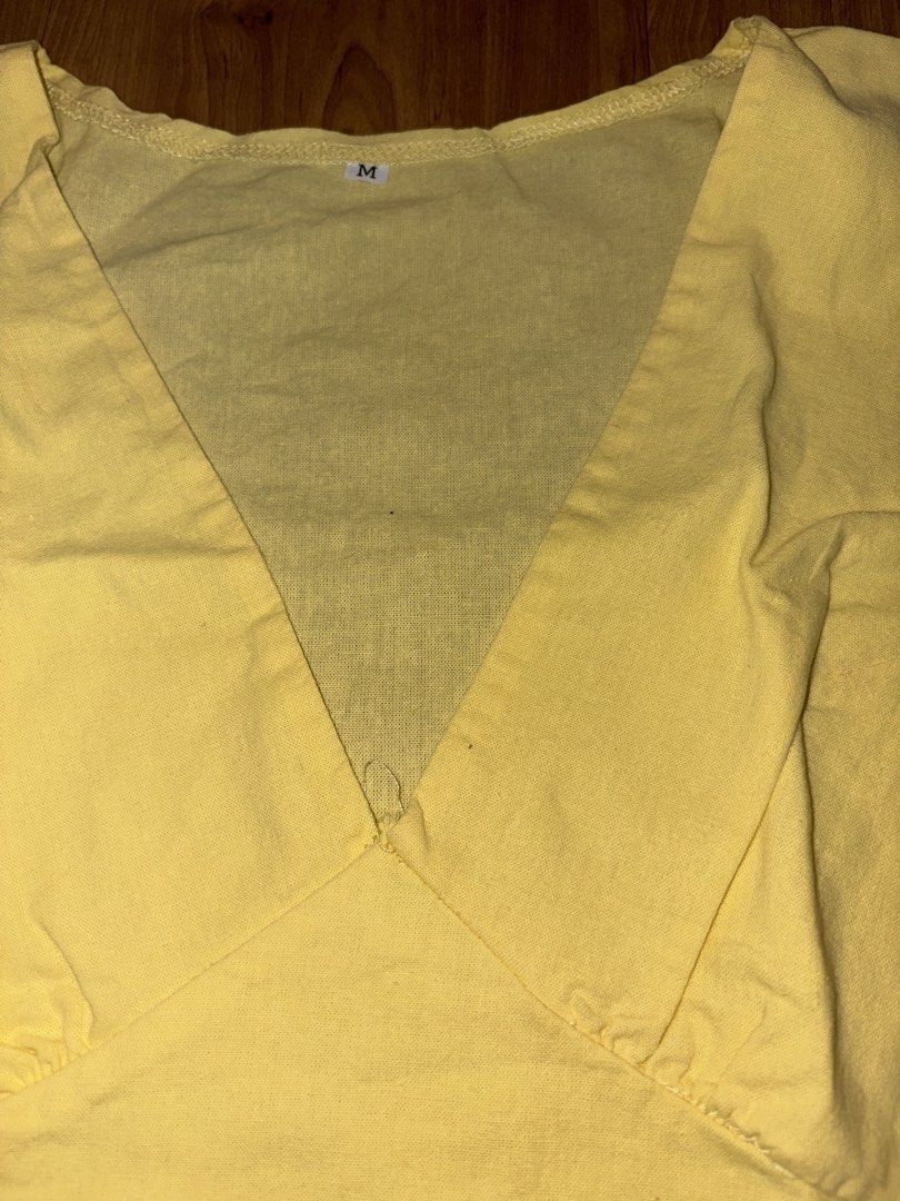 Yellow V-Neck Wrap Style Sleeveless Top Size M (Category: Sleeveless) located in Manila. Submitted by maddsd_ (Listing ID 1449846242, Image 3). Description: - Yellow sleeveless top - V-neckline - Wrap-style front with side tie details - Lightweight fabric - Tagged size M - Ideal for casual wear.