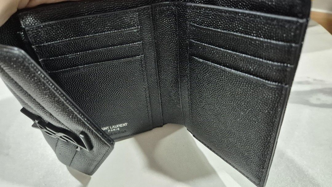 YSL Envelope Monogram Trifold Wallet (Category: Wallets & Card holders) located in Makati City. Submitted by nixxtann_turtle (Listing ID 1449907259, Image 1). Description: YSL Envelope Monogram Trifold Wallet featuring black Grain de Poudre leather and matte black hardware. Disclaimer: Not original..