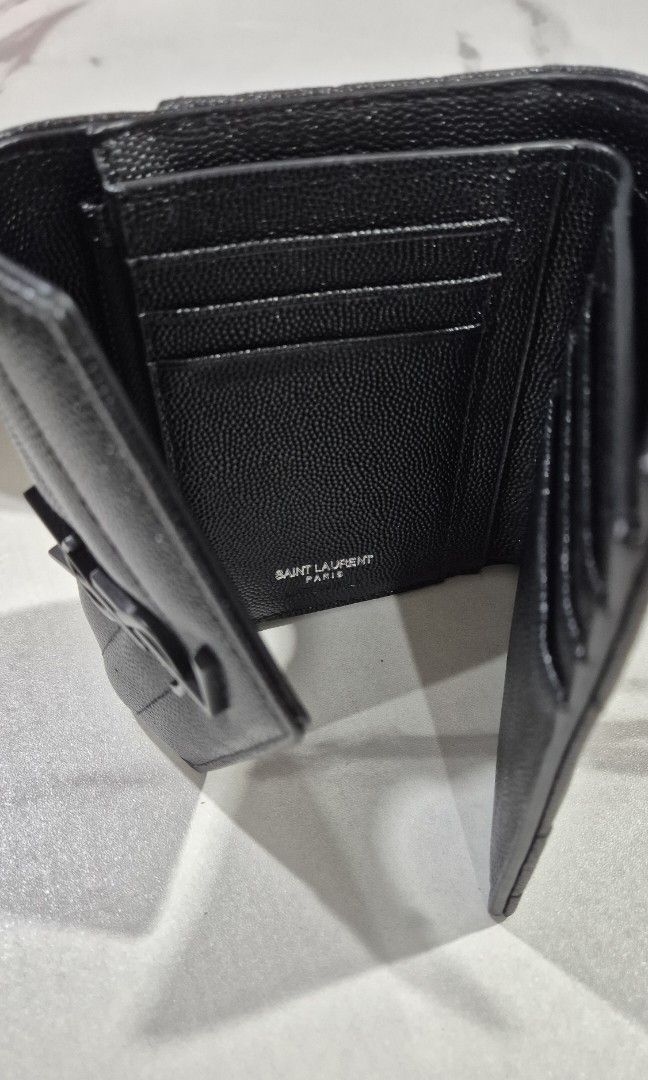 YSL Envelope Monogram Trifold Wallet (Category: Wallets & Card holders) located in Makati City. Submitted by nixxtann_turtle (Listing ID 1449907259, Image 3). Description: YSL Envelope Monogram Trifold Wallet featuring black Grain de Poudre leather and matte black hardware. Disclaimer: Not original..