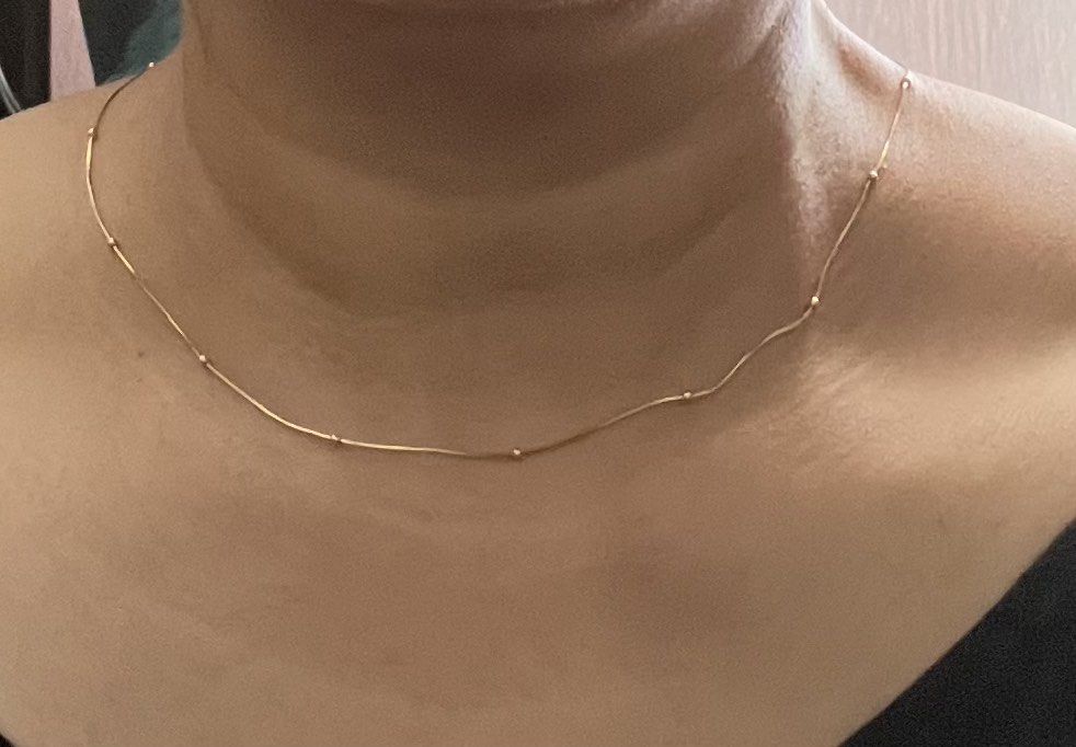 18K Gold Necklace with Beads (Category: Necklaces) located in Paranaque City. Submitted by richezlremo6165 (Listing ID 1447886668, Image 2). Description: - Genuine 18K gold necklace - Delicate snake chain style - Features small, elegant beads - Secure lobster clasp closure - Lightweight and comfortable for daily wear - Ideal for layering or as a standalone piece -18 inches long -2.7 grams 7500/gram.