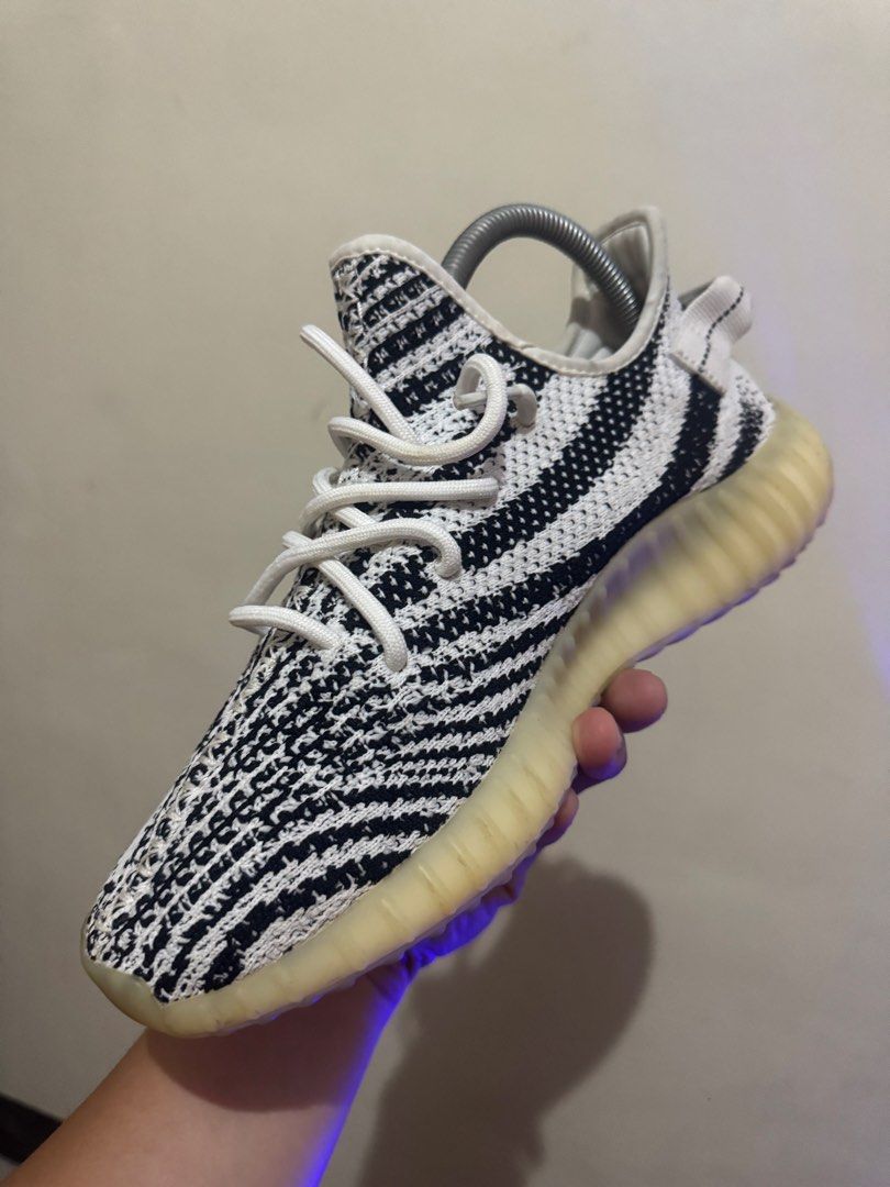 Adidas Yeezy Boost 350 V2 Zebra (Category: Sneakers) located in Las Pinas. Submitted by iduys16 (Listing ID 1449983720, Image 3). Description: - Classic Zebra Yeezy design - White and black primeknit upper - Red 'SPLY-350' text accent - Translucent midsole with Boost cushioning - Perfect for sneaker collections and everyday style.