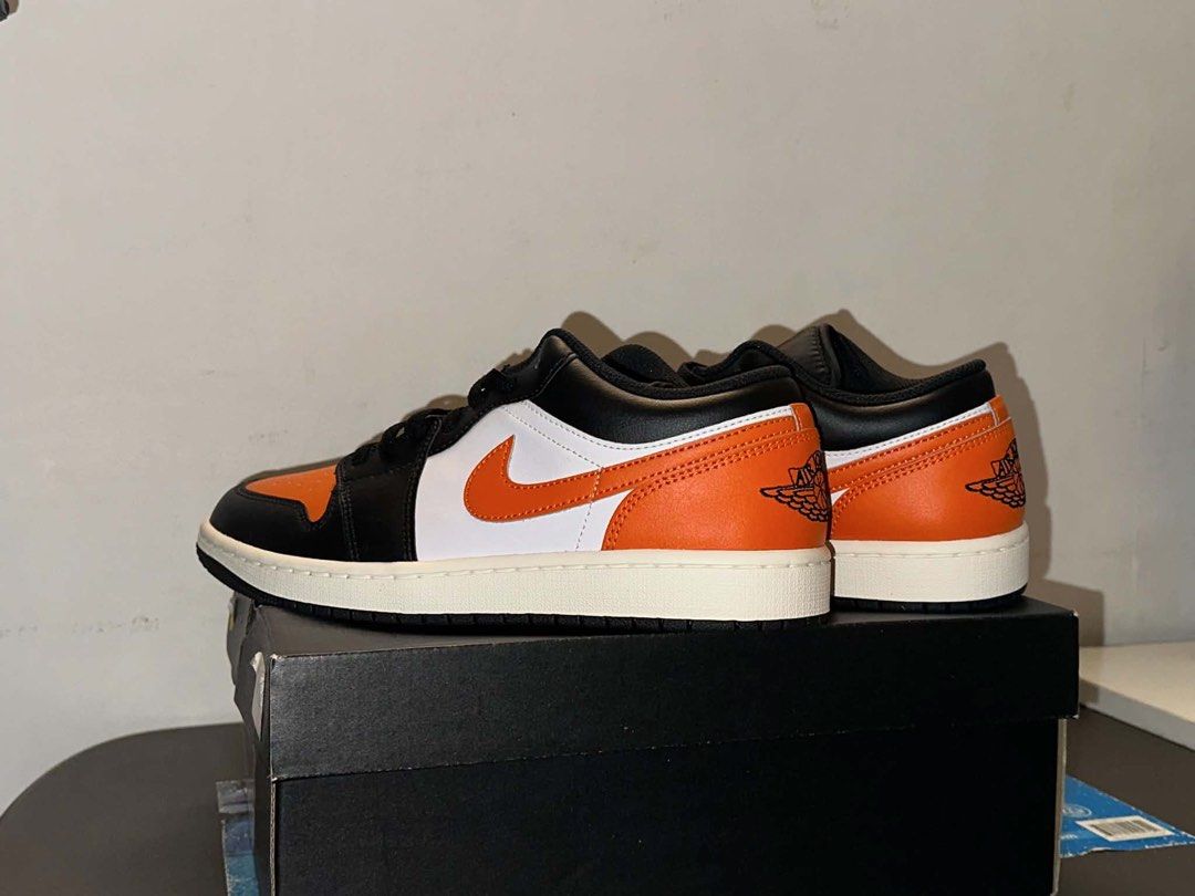 Air Jordan 1 Low "Shattered Backboard" (Category: Sneakers) located in Cabuyao City. Submitted by vladimyrkyle (Listing ID 1450108751, Image 2). Description: - Authentic (from Dubai) - Never been used - Classic Air Jordan 1 Low - Popular Shattered Backboard colorway - Black, white, and orange leather - Clean and ready for a new owner - Comes with original box - Iconic and stylish kicks RFS: wrong size.