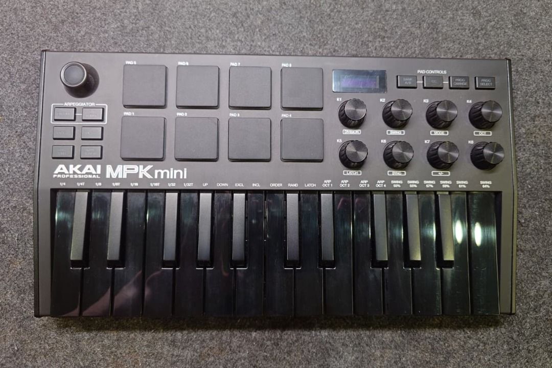 AKAI MPK mini MIDI Keyboard Controller with Soft Shell Case and Pedal (Category: Musical Instruments) located in Quezon City. Submitted by abztan401331 (Listing ID 1450079337, Image 2). Description: - AKAI MPK mini MIDI keyboard controller - Includes: USB cable, soft shell protective case, pedal - Barely used.
