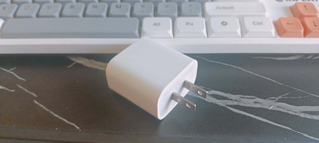 Apple USB-C Power Adapter Charger Original (Category: Chargers & Cables) located in Manila. Submitted by rupert01 (Listing ID 1449969535, Image 1). Description: - Apple USB-C Power Adapter - Color: White - Plug Type: Standard US - Compatibility: iPhones, iPads, and other USB-C devices - Features: Compact and portable - Ideal for: Travel or as a spare charger.
