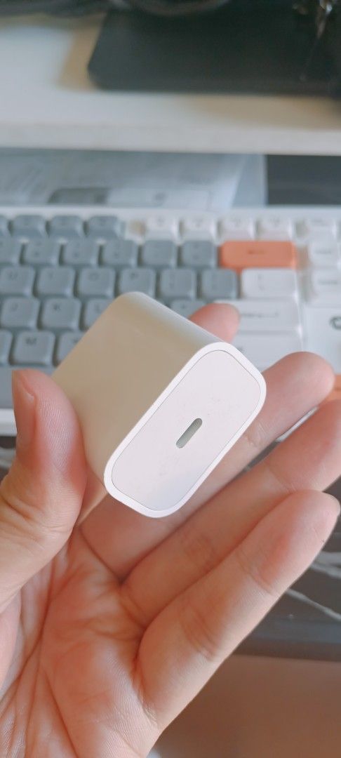 Apple USB-C Power Adapter Charger Original (Category: Chargers & Cables) located in Manila. Submitted by rupert01 (Listing ID 1449969535, Image 3). Description: - Apple USB-C Power Adapter - Color: White - Plug Type: Standard US - Compatibility: iPhones, iPads, and other USB-C devices - Features: Compact and portable - Ideal for: Travel or as a spare charger.