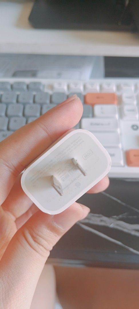 Apple USB-C Power Adapter Charger Original (Category: Chargers & Cables) located in Manila. Submitted by rupert01 (Listing ID 1449969535, Image 2). Description: - Apple USB-C Power Adapter - Color: White - Plug Type: Standard US - Compatibility: iPhones, iPads, and other USB-C devices - Features: Compact and portable - Ideal for: Travel or as a spare charger.