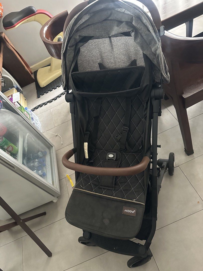 Aprica Rollux Stroller (Category: Strollers) located in Manila. Submitted by pure.brown.sugar (Listing ID 1450120405, Image 1). Description: - Aprica stroller in dark grey with brown handle - Secure 5-point harness - Folds compactly for easy storage - Ideal for everyday use.