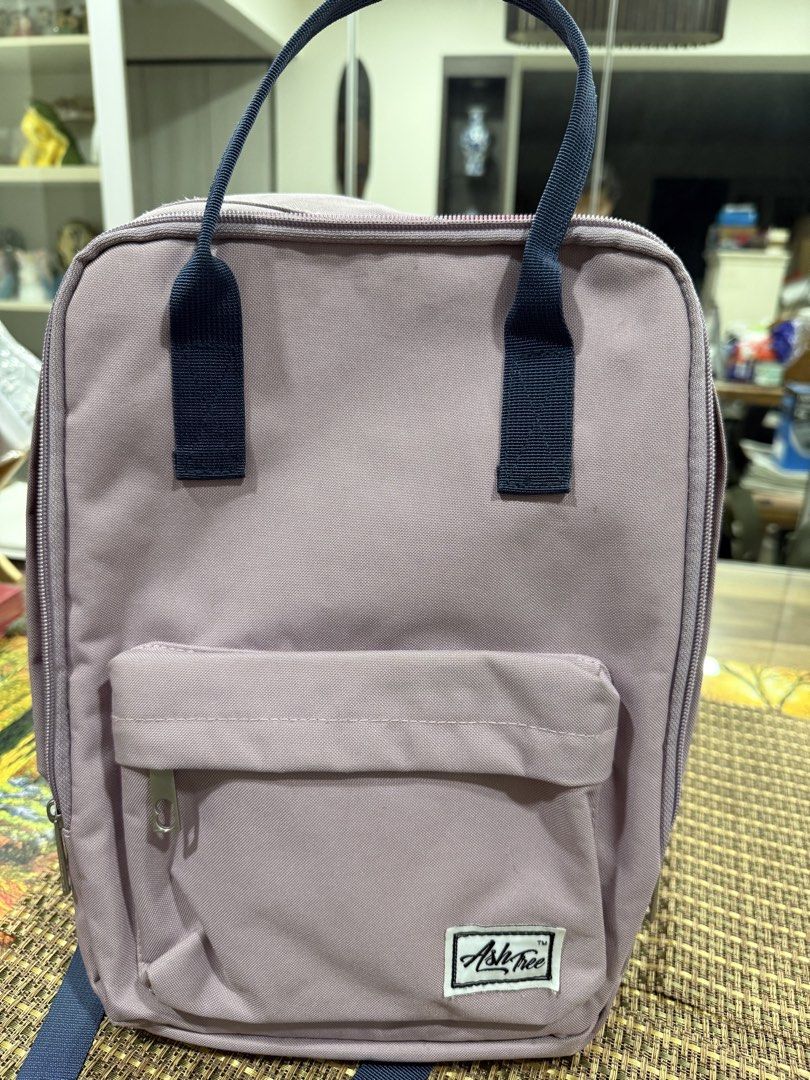 Ash Tree Backpack - Lavender (Category: Backpacks) located in Singapore. Submitted by younghawk-ea1f (Listing ID 1450119921, Image 1). Description: - Ash & Elm lavender backpack - Front zip pocket - Side pockets - Red and white striped interior lining all clean - Adjustable shoulder straps - Ideal for everyday use.