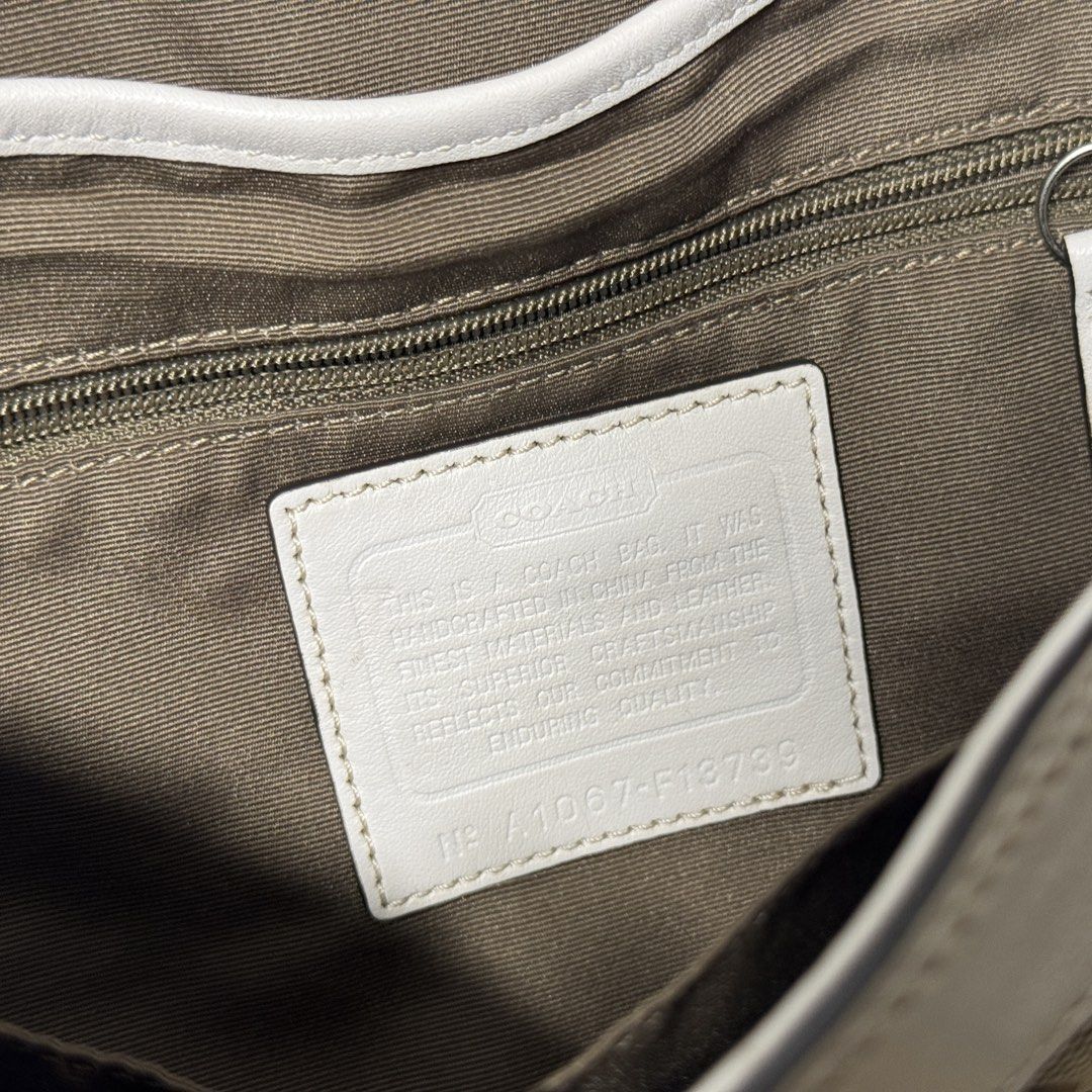 Authentic Coach Signature Canvas Shoulder Bag (Category: Tote Bags) located in San Carlos City. Submitted by chanminscart (Listing ID 1450092941, Image 3). Description: can be negotiable ✔️ Clean interior ✔️ Hangtag included ✔️ Authentic (serial number shown) Flaws: Minor signs of usage.Has a few small marks on the canvas, some creaising & light hardware scratches..