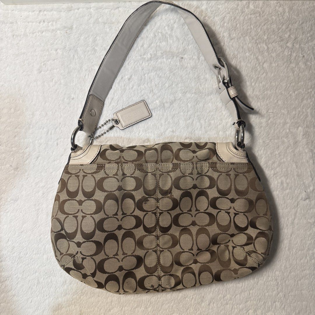 Authentic Coach Signature Canvas Shoulder Bag (Category: Tote Bags) located in San Carlos City. Submitted by chanminscart (Listing ID 1450092941, Image 2). Description: can be negotiable ✔️ Clean interior ✔️ Hangtag included ✔️ Authentic (serial number shown) Flaws: Minor signs of usage.Has a few small marks on the canvas, some creaising & light hardware scratches..