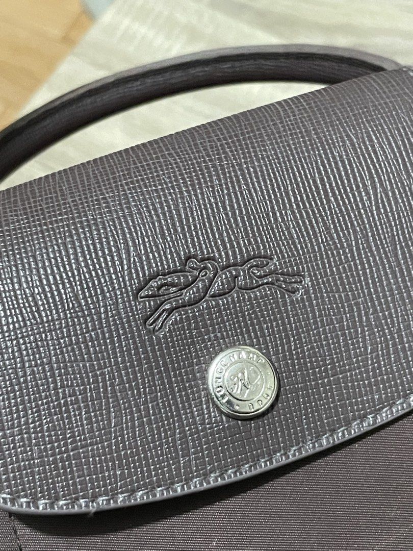 Authentic Longchamp Modele Depose Brown (Category: Luxury Bags & Wallets) located in Bulacan. Submitted by erinbtrc (Listing ID 1450041258, Image 3). Description: 9.5/10 Condition Color Brown Authentic Comes with a Strap Minor flaws only (Zipper fading) Can do Same Day Delivery (Lalamove) along Metro Manila or J&T Delivery.