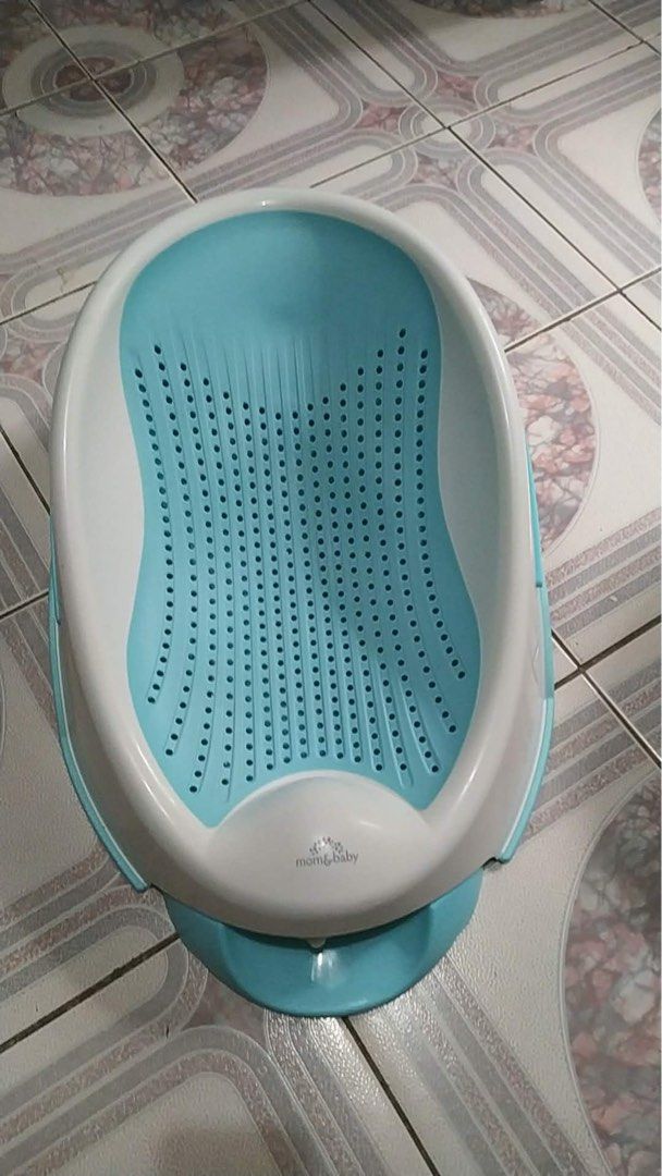 Baby Bath Tub Seat (Category: Bathtub & Bath Accessories) located in Caloocan City. Submitted by anzmxlb (Listing ID 1449978163, Image 2). Description: - Blue baby bath tub - Built-in seat for safety and comfort - Drainage holes for easy emptying - Perforated light blue and white seat insert - Easy to clean.