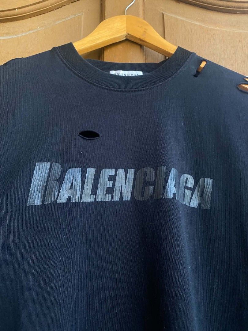Balenciaga logo oversized distressed shirt black (Category: Luxury Apparel) located in Cabuyao City. Submitted by PHdowner30 (Listing ID 1449969270, Image 3). Description: FOR SALE ONLY Balenciaga logo oversized distressed shirt black Size: M ( 24x31 ) Excellent condition Complete tags P600 + SF negotiable Pm.