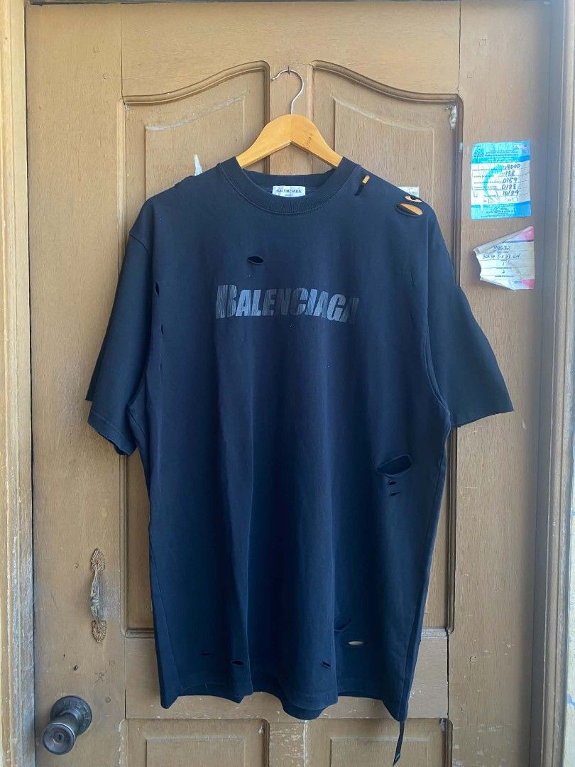 Balenciaga logo oversized distressed shirt black (Category: Luxury Apparel) located in Cabuyao City. Submitted by PHdowner30 (Listing ID 1449969270, Image 1). Description: FOR SALE ONLY Balenciaga logo oversized distressed shirt black Size: M ( 24x31 ) Excellent condition Complete tags P600 + SF negotiable Pm.