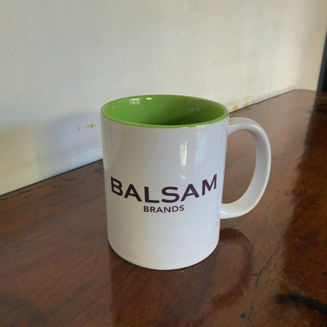 Balsam Brands White Mug with Green Interior (Category: Coffee & Tea Tableware) located in Las Pinas. Submitted by saebisells (Listing ID 1450057767, Image 2). Description: ↠ Classic white mug with a vibrant green interior. ↠ Features the official Balsam Brands logo. ↠ Ideal for your favorite hot beverages like coffee or tea. ↠ Versatile for use at home or in the office. ↠ Simple, timeless design..