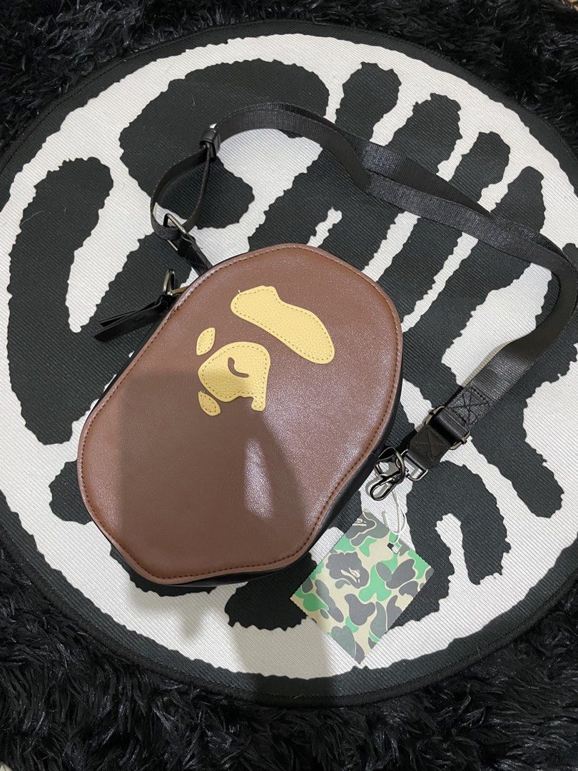 BAPE Ape Head Brown Crossbody Bag (Category: Sling Bags) located in Manila. Submitted by vensen1798495 (Listing ID 1450077455, Image 2). Description: - Iconic BAPE Ape Head design - Stylish brown color - Durable black adjustable strap - Secure zipper closure - Brand new with original tags - Ideal for carrying daily essentials - Unique and eye-catching accessory 800 Pesos.