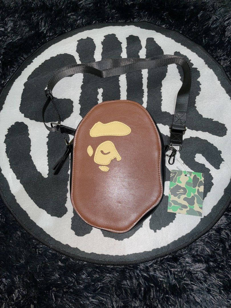 BAPE Ape Head Brown Crossbody Bag (Category: Sling Bags) located in Manila. Submitted by vensen1798495 (Listing ID 1450077455, Image 1). Description: - Iconic BAPE Ape Head design - Stylish brown color - Durable black adjustable strap - Secure zipper closure - Brand new with original tags - Ideal for carrying daily essentials - Unique and eye-catching accessory 800 Pesos.