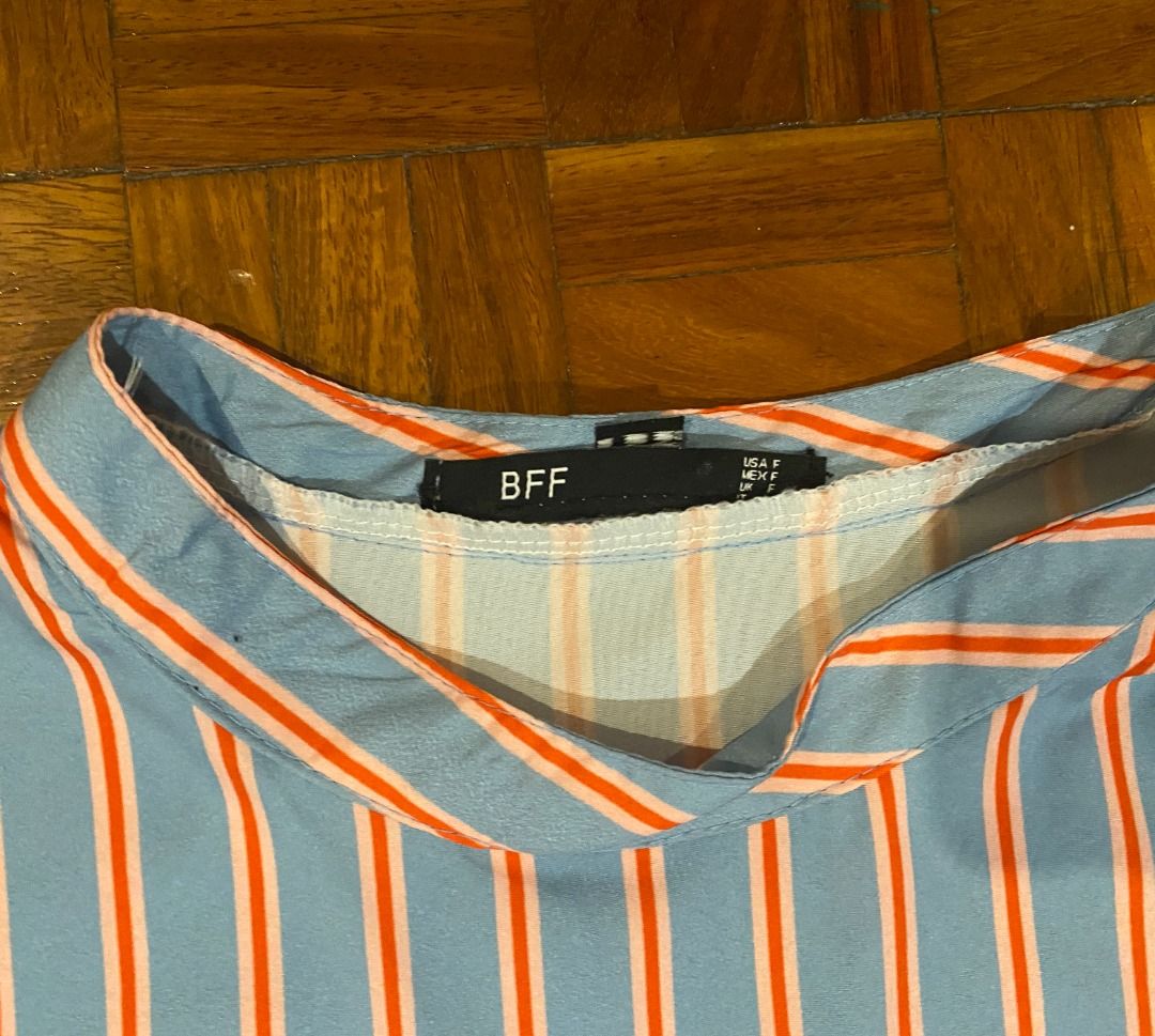 BFF Blue & Orange Striped Long Sleeve Top (Category: Longsleeves) located in Makati City. Submitted by robin_l (Listing ID 1450050280, Image 2). Description: - Blue fashionable long-sleeved top (purchased in Thailand) - Features eye-catching orange stripes - One shoulder is exposed - Button details on cuffs - Ideal for casual outings This is like new! Worn only twice. Notes: 1. Please check my other items to save on shipping! 2. Please respect my