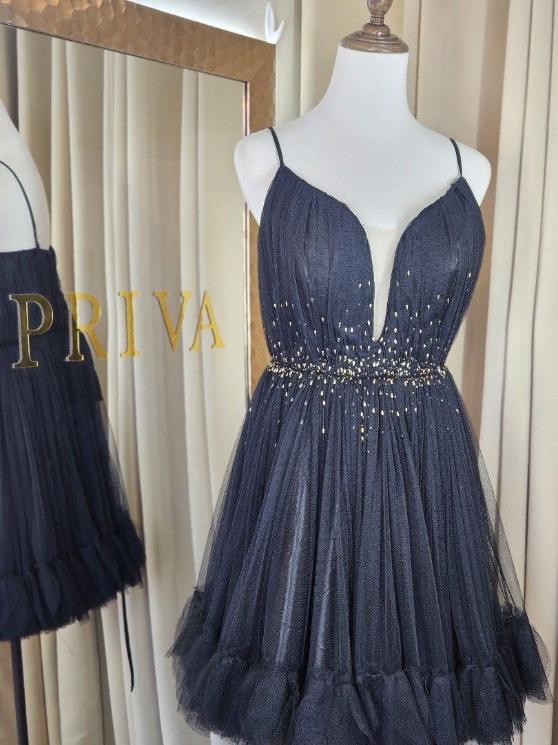 Black Tulle Beaded Party Dress (Category: Dresses) located in Cabuyao City. Submitted by 2d8764ba06fae61bbbd0dbb5af913b (Listing ID 1449977867, Image 2). Description: - fits medium to large - Short black party dress - Sweetheart neckline with thin straps - Bodice embellished with gold beads - Tulle overlay with a ruffled hem - Ideal for parties and special events.