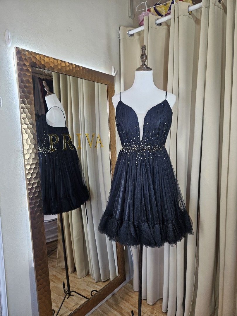Black Tulle Beaded Party Dress (Category: Dresses) located in Cabuyao City. Submitted by 2d8764ba06fae61bbbd0dbb5af913b (Listing ID 1449977867, Image 3). Description: - fits medium to large - Short black party dress - Sweetheart neckline with thin straps - Bodice embellished with gold beads - Tulle overlay with a ruffled hem - Ideal for parties and special events.