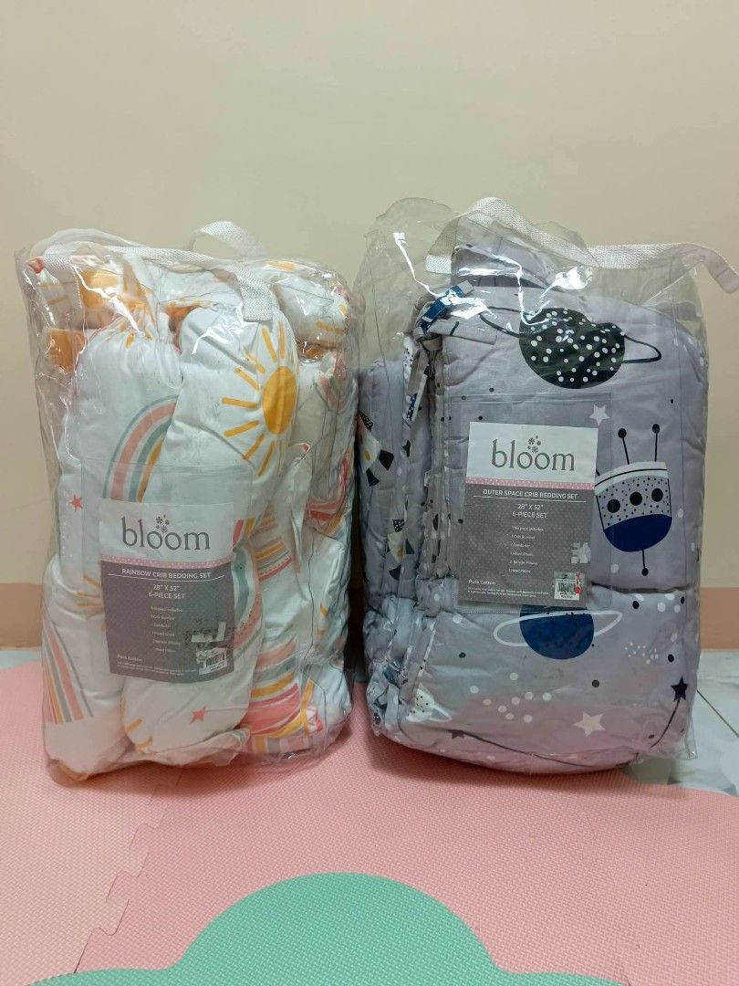 Bloom Baby Crib Bedding Set - Space & Rainbow Designs (Category: Cots & Cribs) located in San Jose del Monte. Submitted by urban_sissyshop (Listing ID 1449959653, Image 1). Description: - Two sets of Bloom baby crib bedding available. - Both sets are brand new and still in original packaging. - Set 1: Fun space theme with rockets and planets. - Set 2: Cheerful rainbow and sun design. - Ideal for creating a beautiful nursery. - Special offer: Get 