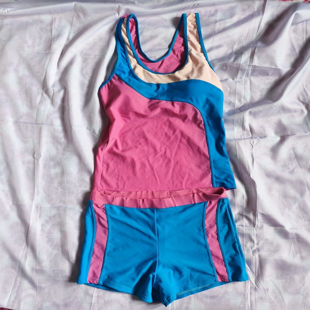 Blue & Pink Tankini (Top & Shorts) (Category: Rash guard) located in Manila. Submitted by kiya.picks (Listing ID 1449985215, Image 1). Description: Brand new but with flaws. Size: xs - s Honest issue: garter on shorts is deformed.
