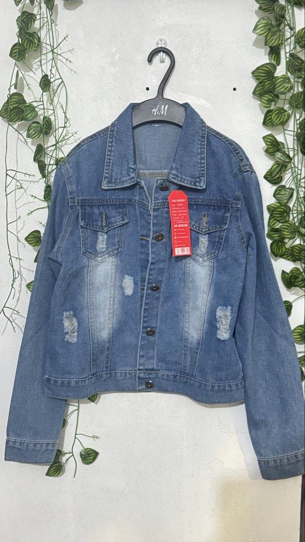 Blue Distressed Denim Jacket (Category: Coats, Jackets and Outerwear) located in Makati City. Submitted by hello_ph (Listing ID 1449960344, Image 1). Description: - Classic blue denim jacket - Distressed look with rips - Button-up front and collar - Two chest pockets with button closures - Long sleeves with button cuffs - Versatile for layering over tops or dresses RFS does not fit M on tag but xs to small in actual.