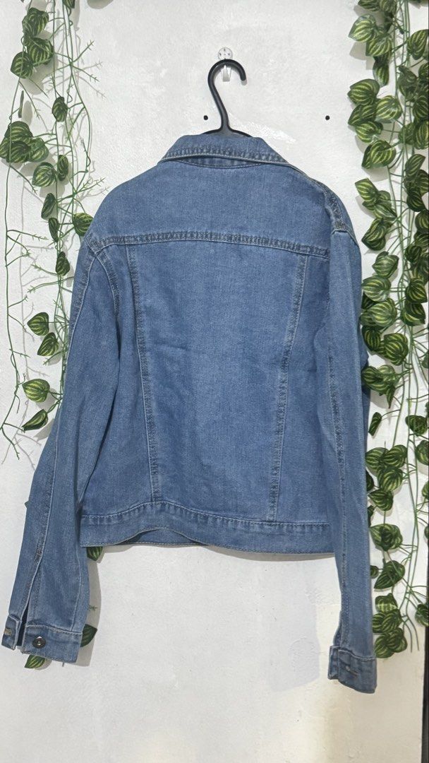 Blue Distressed Denim Jacket (Category: Coats, Jackets and Outerwear) located in Makati City. Submitted by hello_ph (Listing ID 1449960344, Image 2). Description: - Classic blue denim jacket - Distressed look with rips - Button-up front and collar - Two chest pockets with button closures - Long sleeves with button cuffs - Versatile for layering over tops or dresses RFS does not fit M on tag but xs to small in actual.