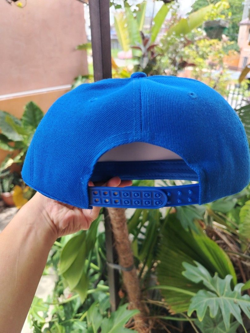 Blue Snapback Cap (Category: Caps & Hats) located in Valenzuela. Submitted by athena_cypress (Listing ID 1450055563, Image 3). Description: - Classic blue snapback cap - Flat brim style - Adjustable snap closure for a custom fit - Versatile for everyday wear - Provides excellent sun protection.