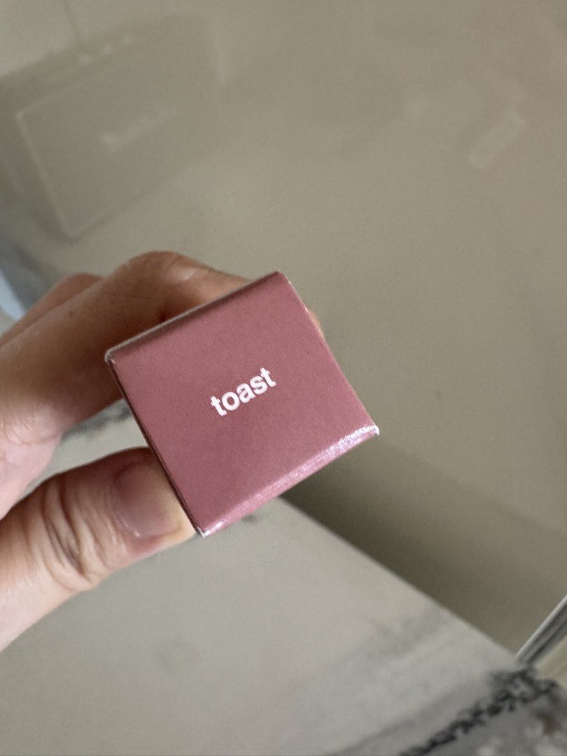 BNIB Rhode Peptide Lip Tint in Toast (Category: Makeup) located in Manila. Submitted by helloseptembermnl (Listing ID 1449963252, Image 3). Description: - Rhode Peptide Lip Tint - Shade: Toast - Type: Tinted lip balm with hydration - Size: 10ml - Condition: Minor wear on packaging, product inside likely unused - Ideal for: Everyday wear.