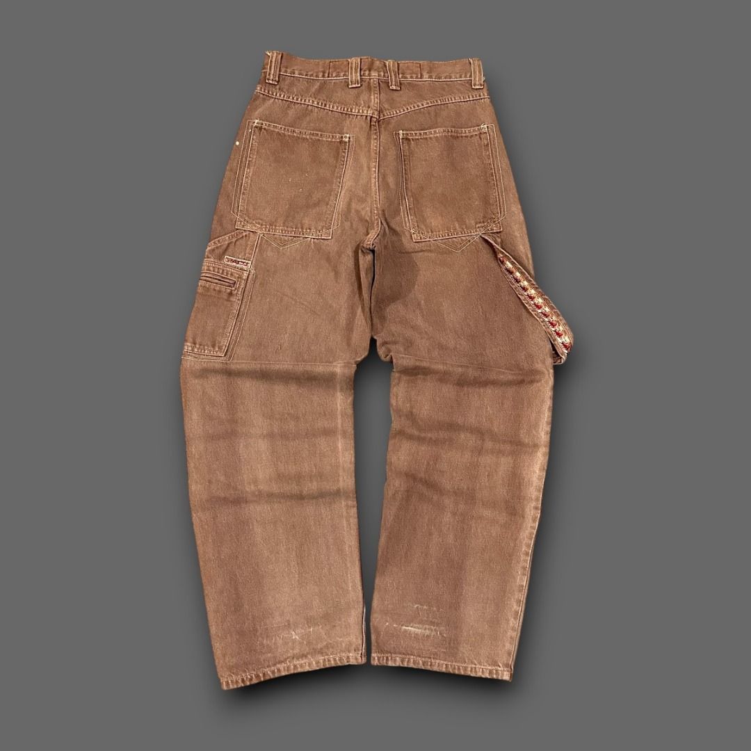 Brown Carpenter Jeans with Orange Embroidery (Category: Jeans) located in Pasig City. Submitted by postrano.harvey (Listing ID 1450031610, Image 2). Description: Vintage Paco Double Knee Pants Waist: 31" Length: 37" Leg opening: 9.5" Condition: 9/10 Color rate: 9/10 Issue: None DM to purchase..