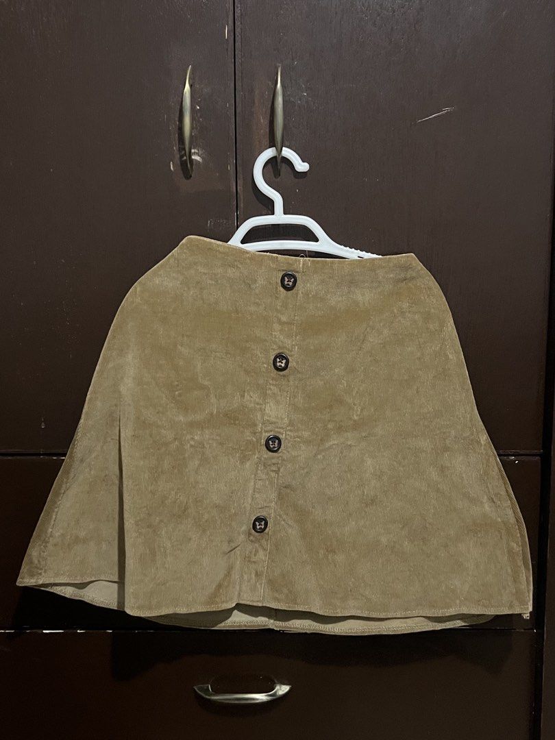 Brown Corduroy Button-Up Skirt (Category: Skirts) located in Batangas. Submitted by k8declutters (Listing ID 1450050575, Image 1). Description: - Cute brown corduroy skirt - Features buttons down the front - Made of soft, comfortable material.