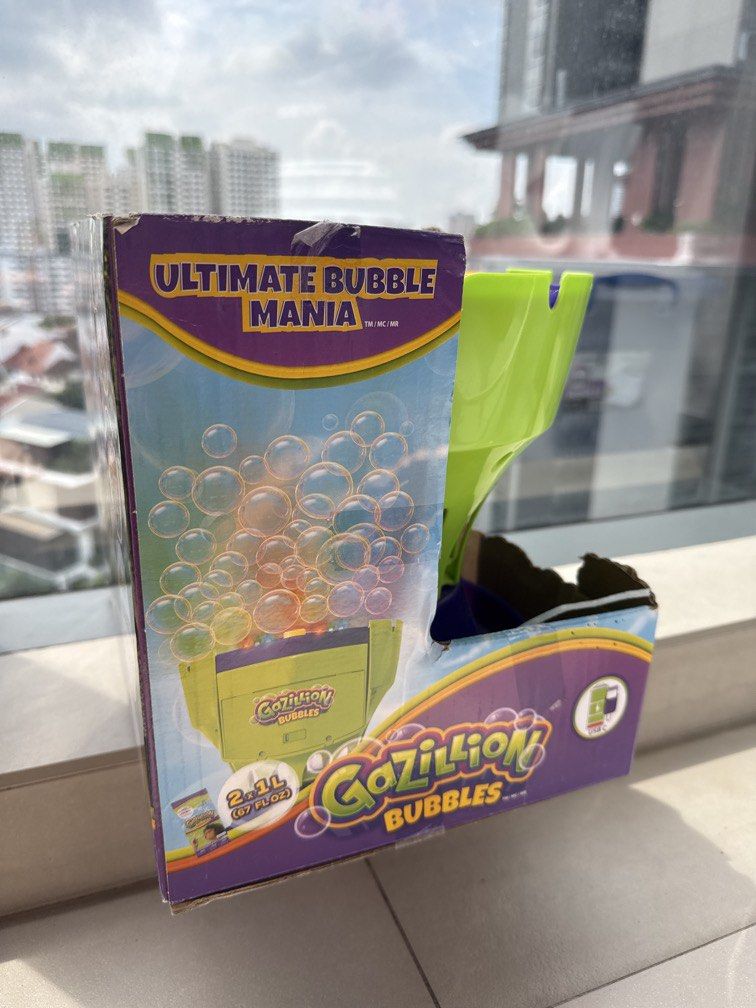 Bubble Machine (Category: Kids Toys) located in Singapore. Submitted by stockemup (Listing ID 1450002399, Image 2). Description: BNIB rechargeable battery! Got 1 already, this is spare. Endless fun for kids.
