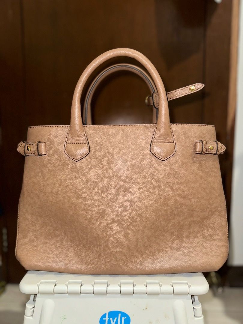 Burberry Medium Banner Leather Tote Bag (Category: Luxury Bags & Wallets) located in Santa Rosa. Submitted by ardpilr (Listing ID 1449986735, Image 2). Description: - Classic Burberry Medium Banner tote bag - Tan textured leather - Top handles and crossbody straps - Comes with original dust bag - Comes with original tags still attached - Recently professionally cleaned by Doctor Leather.