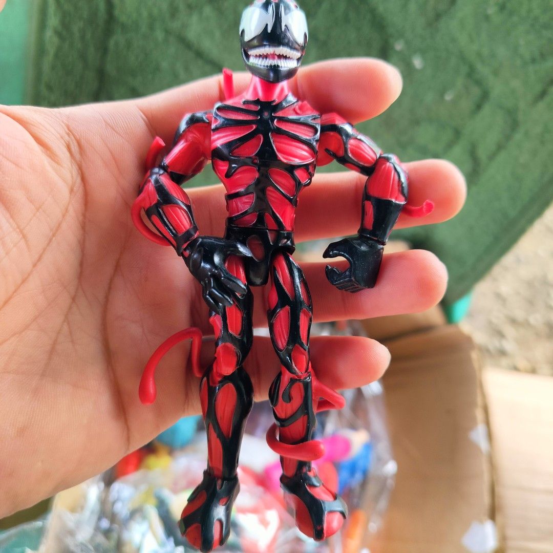 Carnage Action Figure Toy (Category: Figurines & Statues) located in Plaridel. Submitted by klayskolektibols (Listing ID 1450033971, Image 1). Description: - Carnage action figure - Striking red and black design - Made of durable plastic - Perfect for collectors and fans of the character.