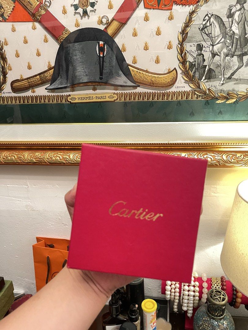 Cartier Red Gift Box (Category: Luxury Accessories) located in Marilao. Submitted by wardrovearchives (Listing ID 1450062780, Image 1). Description: - Authentic Cartier red gift box - Features gold Cartier logo on top - Includes outer sleeve - Ideal for storing jewelry or as a gift box - Approximate dimensions: 4x4x4 inches.