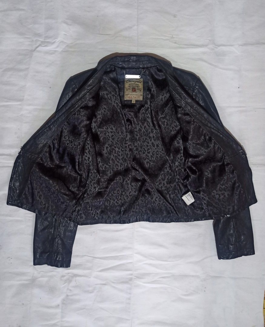 Chevignon Legend Label Black Leather Jacket (Category: Coats, Jackets and Outerwear) located in Manila. Submitted by mbk.thrift (Listing ID 1450132844, Image 2). Description: - Brand: Chevignon - Series: Legend Label - Style: Double-breasted leather jacket - Details: Button accents - Interior: Leopard print lining - Size: L - Look: Stylish.