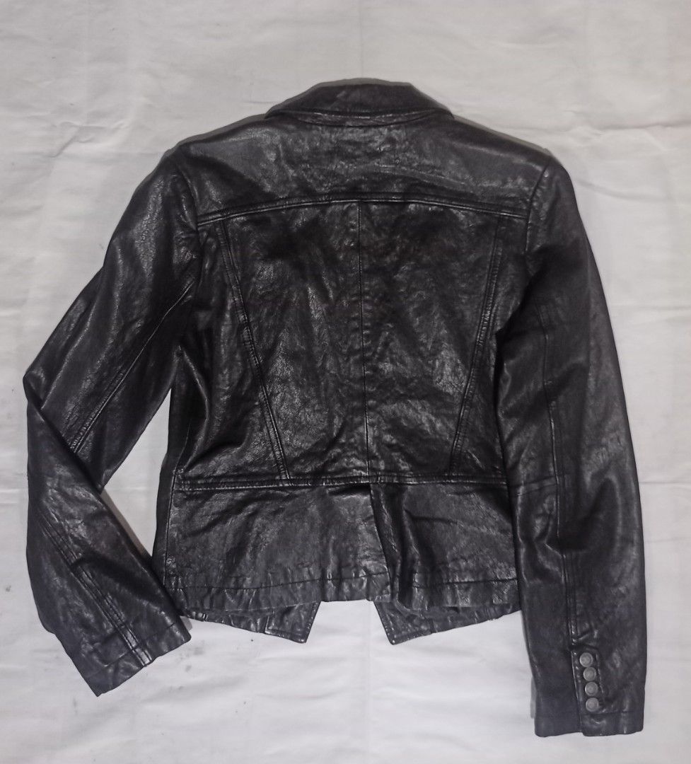 Chevignon Legend Label Black Leather Jacket (Category: Coats, Jackets and Outerwear) located in Manila. Submitted by mbk.thrift (Listing ID 1450132844, Image 3). Description: - Brand: Chevignon - Series: Legend Label - Style: Double-breasted leather jacket - Details: Button accents - Interior: Leopard print lining - Size: L - Look: Stylish.