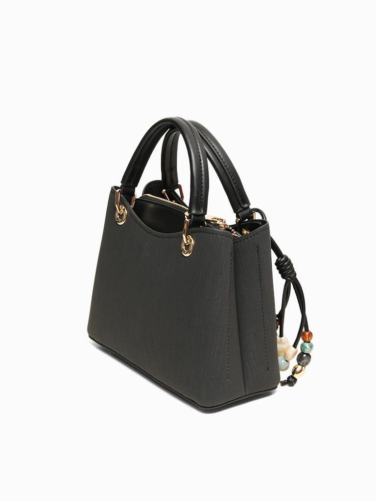 CLN Black Keira handbag (Category: Luxury Bags & Wallets) located in Manila. Submitted by shoes.moe (Listing ID 1450036804, Image 2). Description: - Brand: CLN - Color: Black - Material: Textured - Handle: Top handle - Hardware: Gold - Closure: Zipper - Features: Detachable charm with beads, patterned interior lining, spacious main compartment - Style: Great for everyday use - SRP 2499 PHP.