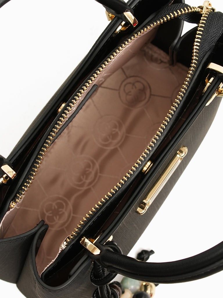 CLN Black Keira handbag (Category: Luxury Bags & Wallets) located in Manila. Submitted by shoes.moe (Listing ID 1450036804, Image 3). Description: - Brand: CLN - Color: Black - Material: Textured - Handle: Top handle - Hardware: Gold - Closure: Zipper - Features: Detachable charm with beads, patterned interior lining, spacious main compartment - Style: Great for everyday use - SRP 2499 PHP.