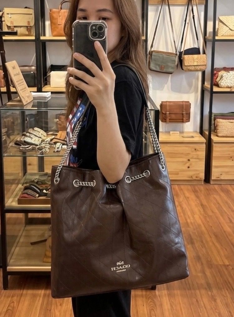Coach Evelyn Chain shoulder bag (Category: Luxury Bags & Wallets) located in Caloocan City. Submitted by rhaenys123456_eagle (Listing ID 1450050120, Image 2). Description: No flaws. Ukaysource. Sophisticated Choco brown color. All hardwares have coach engrave Silver hardwares. Coded and with Brand creed. Made in vietnam Last price pls. No haggling Shipping nationwide + Sf .