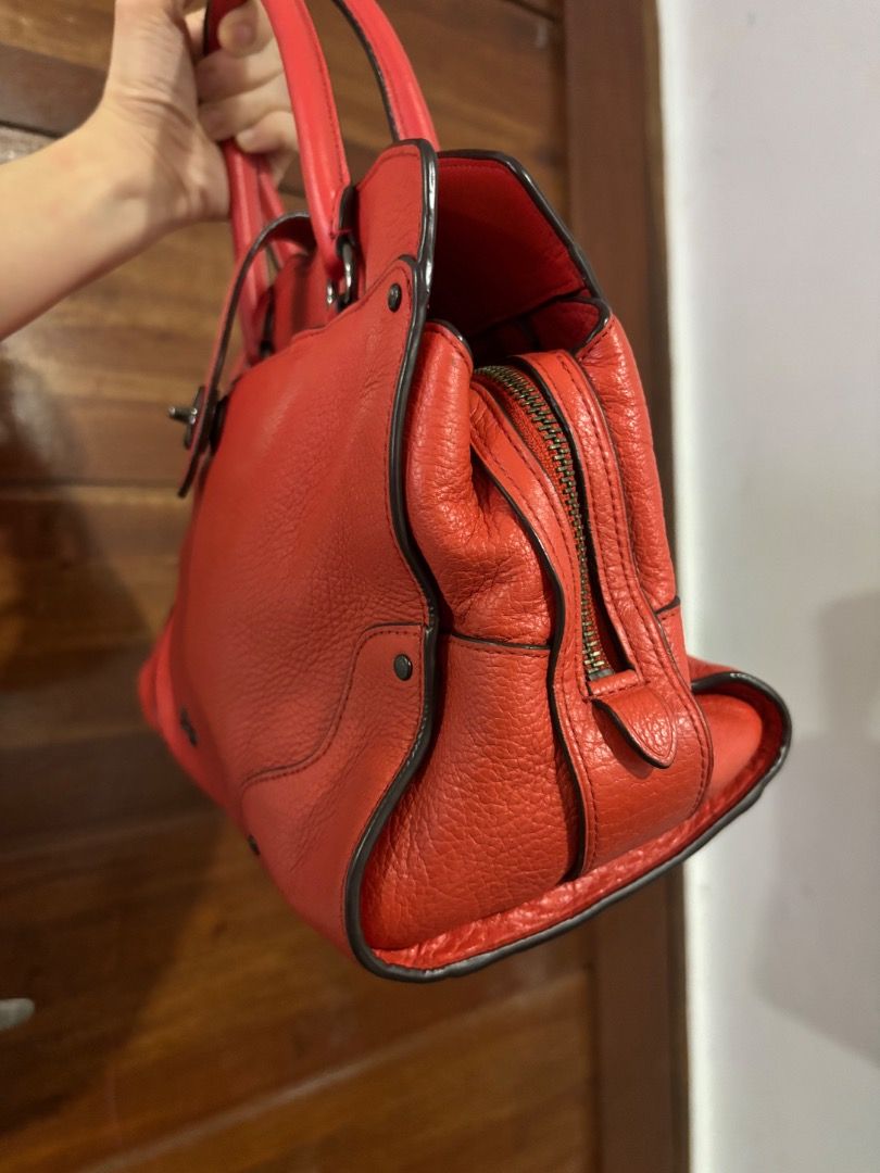 Coach mercer (Category: Luxury Bags & Wallets) located in Caloocan City. Submitted by rhaenys123456_eagle (Listing ID 1450052920, Image 2). Description: - Classic red leather handbag - Textured finish - Secure side zipper closure - Protective metal studs on the bottom - Comfortable double handles - Semi med size only - Kasya tablet NOT laptop, kasya foldable payong or long wallet -Clean interiors -Flaws: Scratch sa creed. Missing sling .