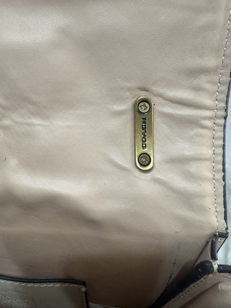 Coach Signature Canvas Saddle Bag (Category: Luxury Bags & Wallets) located in Malolos. Submitted by urban_thrift_09 (Listing ID 1450101954, Image 3). Description: - Authentic Coach saddle bag - Color: Tan and beige signature canvas with leather trim - Hardware: Gold chain strap and horse and carriage logo - Interior: Coach creed patch and smaller tag - Size: 8”x 7.5”x 3”.