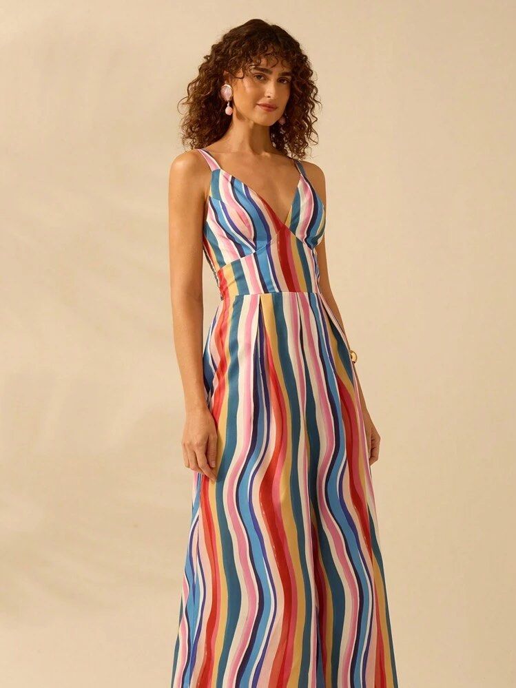 Colorful Striped Maxi Dress (Category: Dresses) located in Manila. Submitted by chaz16 (Listing ID 1450035881, Image 2). Description: - V-neck maxi dress - Vibrant vertical stripe pattern - Adjustable spaghetti straps - Empire waist with a flowy skirt - Ideal for summer outings and vacations - Versatile for dressing up or down.