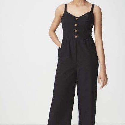 Cotton On Black Button Front Cropped Jumpsuit XS (Category: Jumpsuits) located in Manila. Submitted by chaz16 (Listing ID 1450038746, Image 3). Description: - Black cropped jumpsuit from Cotton On - Features adjustable straps - Button details down the front - Wide leg style - Includes pockets - Comfortable and easy to wear - Perfect for casual outings or dressing up.