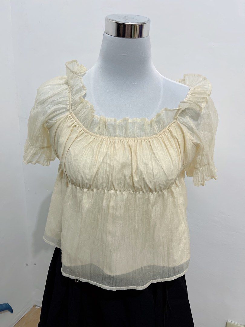 Cream Organza Off-Shoulder Top (Category: Blouses) located in Subic. Submitted by pamyucosrental (Listing ID 1450084094, Image 1). Description: 🧚‍♀️ [RUSH DECLUTTER] Cream Shimmer Organza Off-Shoulder Top 💵 PRICE: ₱99 ONLY! 👗 SIZE: Free Size (Stretchable neckline and chest area, fits Small to Medium) ✨ DESCRIPTION: • Beautiful cream/champagne shimmer fabric that catches the light • Flowy ruffle sleeves, can be worn off-shoulder or square neck 