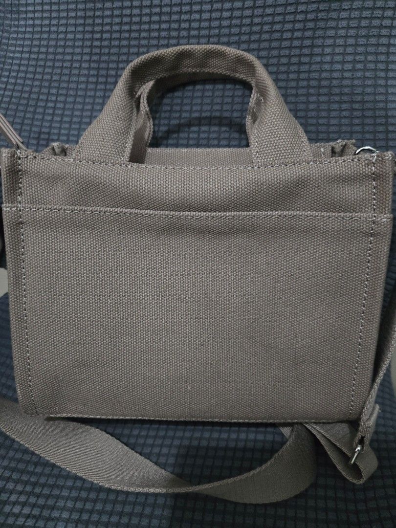 DKNY New York Canvas Tote Bag (Category: Tote Bags) located in Manila. Submitted by opssyyyy (Listing ID 1450035726, Image 3). Description: - Brand: DKNY New York - Type: Canvas Tote Bag - Color: Tan with black lettering - Features: Top handles, detachable shoulder strap, zipper closure - Origin: Made in Cambodia - Ideal for: Everyday use, travel.