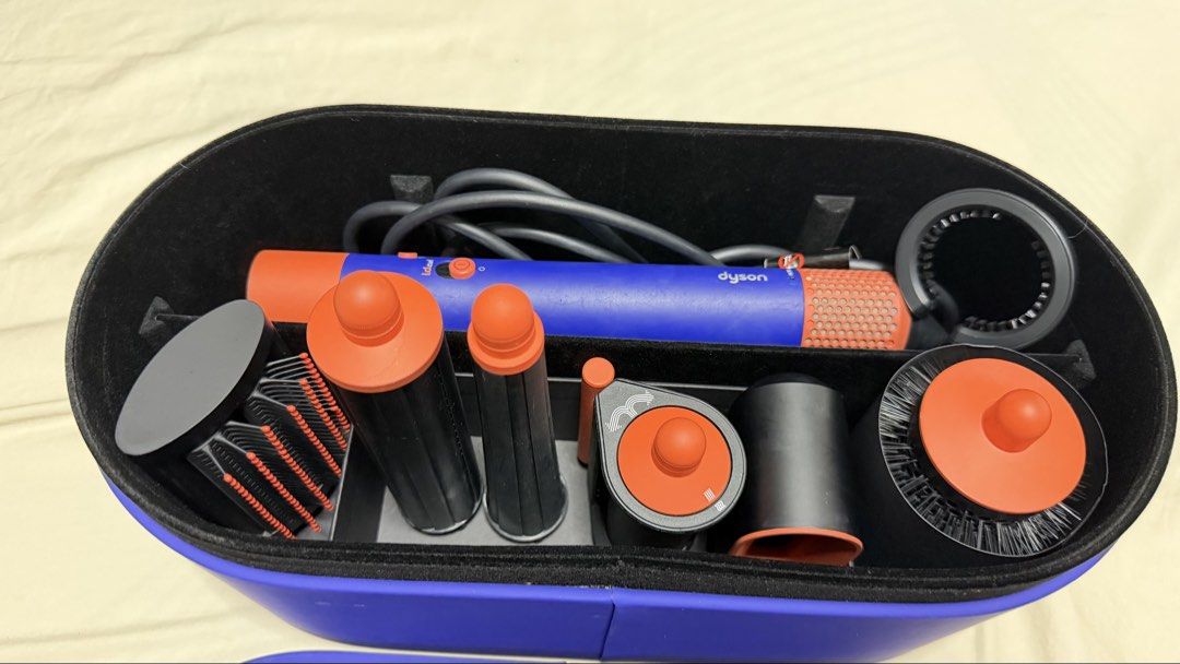 Dyson Airwrap Complete Styler Set (Category: Hair) located in Pasig City. Submitted by razzelsadicon_snow27 (Listing ID 1450051206, Image 2). Description: - Dyson Airwrap Complete Styler - Includes multiple attachments for curling, smoothing, and volumizing - Comes with a storage case - Suitable for all hair types - Achieve salon-quality results at home.