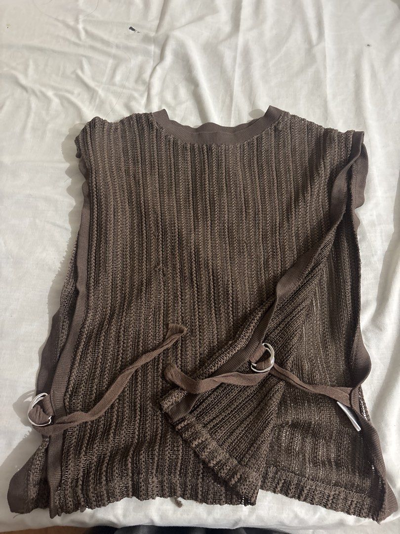 ESSEME Brown Sleeveless Top with Tie (Category: Sleeveless) located in Manila. Submitted by de.clutterthings (Listing ID 1450087038, Image 1). Description: - Brand: ESSEME - Color: Brown - Size: M - Style: Sleeveless knit top - Neckline: Crew neck - Features: Side tie details with silver rings - Material: Open and airy knit fabric - no issues.