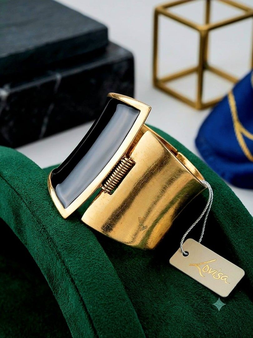 Fancy Bangle (Category: Bracelets) located in Singapore. Submitted by zhmodernmix (Listing ID 1450069276, Image 3). Description: 🔶 Fancy wide, cuff-style bangle 🔶 Striking contrast of brushed rustic gold and glossy black. 🔶 Decorative panel features a smooth, glossy black inlay. 🔶 A visible coiled metal spring sits at the hinge joint on the side..